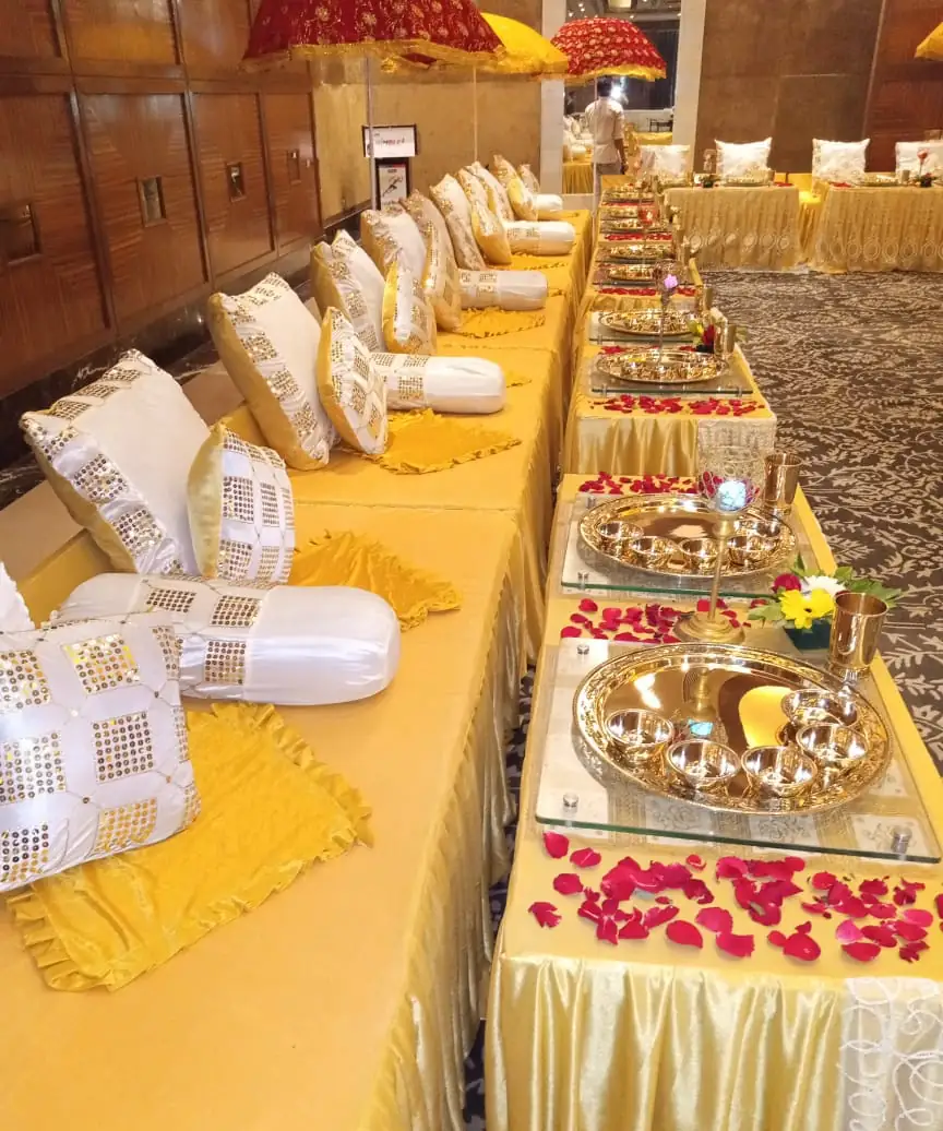 Floor seating with silver thalis and rose petals